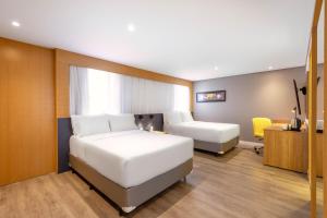 Cama ou camas em um quarto em Holiday Inn Sao Paulo Parque Anhembi by IHG