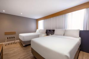 Cama ou camas em um quarto em Holiday Inn Sao Paulo Parque Anhembi by IHG