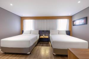 Cama ou camas em um quarto em Holiday Inn Sao Paulo Parque Anhembi by IHG
