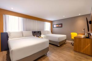 Cama ou camas em um quarto em Holiday Inn Sao Paulo Parque Anhembi by IHG