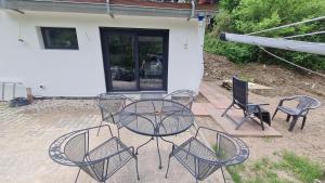 a table and chairs sitting on a patio at Geschäfts- und Monteurs Apartment 2 SZ in Königswinter
