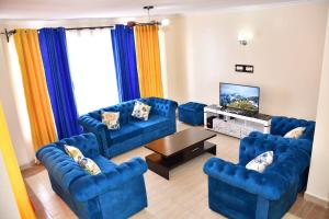 TV a/nebo společenská místnost v ubytování PARKVIEW HOMES-JKIA