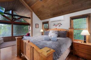 a bedroom with a large bed in a cabin at Mountain Melody in Morganton +96 photos