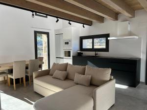 a living room with a couch and a table at Cabana Blanca Turisme Rural in Solsona