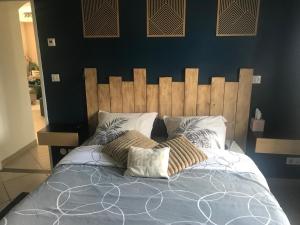 Ένα ή περισσότερα κρεβάτια σε δωμάτιο στο Chambre à 10 minutes du parc Asterix