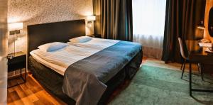 Katil atau katil-katil dalam bilik di Hotel Amadeus by First
