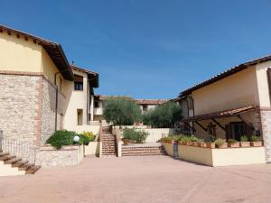 a courtyard of a building with potted plants at La Bella Vista in Collazzone
