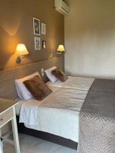 Postel nebo postele na pokoji v ubytování ASPASIA APARTMENTS
