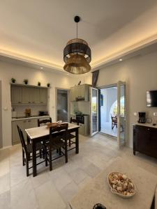 a kitchen and dining room with a table and chairs at Pyrgaki hideway in Agiassos