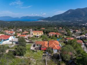 an aerial view of a small village with red roofs at Vangel House in Chaliotata