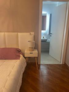 Łóżko lub łóżka w pokoju w obiekcie Bed & Breakfast con vista giardino e piscina