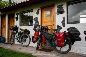 two bikes parked in front of a building at Finca Castillo de Altura in San Juan
