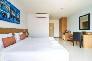 Postel nebo postele na pokoji v ubytování Vapa Hotel - SHA Extra Plus