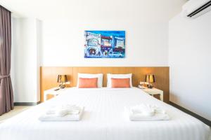 Postel nebo postele na pokoji v ubytování Vapa Hotel - SHA Extra Plus