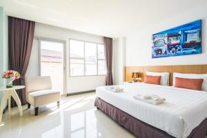 Postel nebo postele na pokoji v ubytování Vapa Hotel - SHA Extra Plus