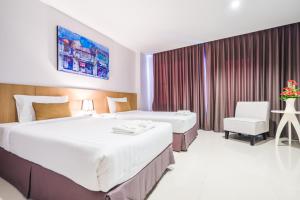 Postel nebo postele na pokoji v ubytování Vapa Hotel - SHA Extra Plus