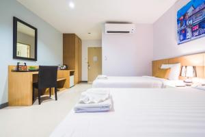 Postel nebo postele na pokoji v ubytování Vapa Hotel - SHA Extra Plus