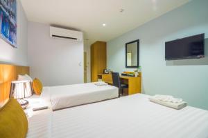 Postel nebo postele na pokoji v ubytování Vapa Hotel - SHA Extra Plus