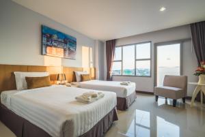 Postel nebo postele na pokoji v ubytování Vapa Hotel - SHA Extra Plus
