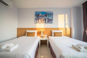 Postel nebo postele na pokoji v ubytování Vapa Hotel - SHA Extra Plus