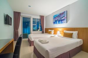 Postel nebo postele na pokoji v ubytování Vapa Hotel - SHA Extra Plus