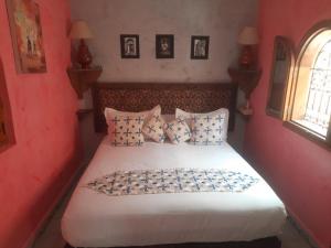 Postel nebo postele na pokoji v ubytování Riad ouhmidi