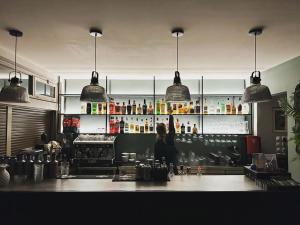 a person standing behind a counter in a kitchen at Ipanema Hotel in Tigaki