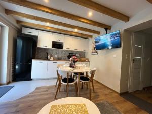 Kuchyň nebo kuchyňský kout v ubytování Studio Rybacka 4 Darłówko