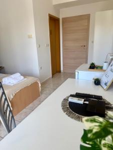a room with a bed and a keyboard on a table at Apartments Ana & Ita in Novalja