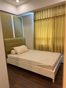 Ένα ή περισσότερα κρεβάτια σε δωμάτιο στο Apartment Trillium Residence 3BR