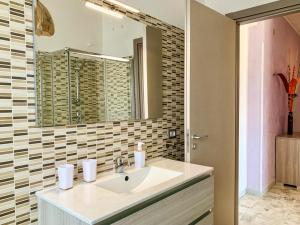 a bathroom with a sink and a mirror at Labanca's Suite in Campobasso +8 photos