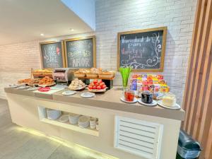 a bakery with a counter with food on it at Paradisiaca Suite Cancun - BEACH CONDO - 4PX in Cancún