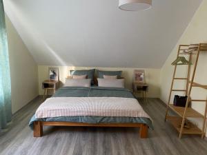 a bedroom with a bed and a ladder at Apartment mit zwei Schlafzimmern in Kerpen