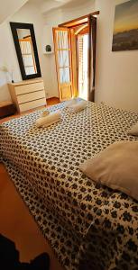 Ein Bett oder Betten in einem Zimmer der Unterkunft Villa townhouse Calvario