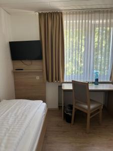 TV a/nebo společenská místnost v ubytování Haven Hotels - Bochum