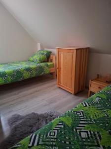 Postel nebo postele na pokoji v ubytování Za Przylaskiem