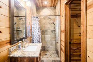 a bathroom with a sink and a shower at Time Well Wasted in Stephens Gap +80 photos