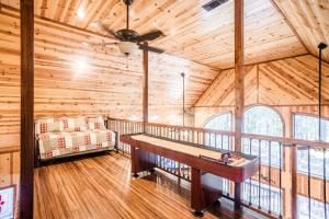 a room with a wooden ceiling with a table in it at Time Well Wasted in Stephens Gap