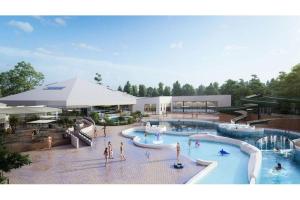 a group of people standing around a swimming pool at Le Cottage de Belle Dune in Fort-Mahon-Plage +39 photos