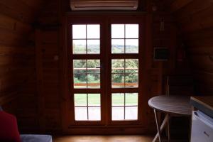a door in a room with a window at Quinta da Devesa -B2 in Vinhais