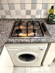 a stove top oven sitting on top of a counter at Cozy Apartment Near Oldtown Antalya in Antalya +12 photos