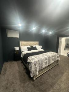 a bedroom with a large bed in a room at Luxury 2 bedroom basement in Bowie
