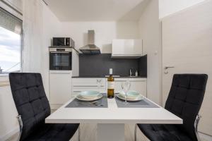 Kuchyň nebo kuchyňský kout v ubytování Studio Apartment Iva