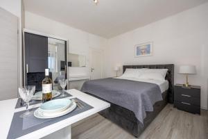 Postel nebo postele na pokoji v ubytování Studio Apartment Iva