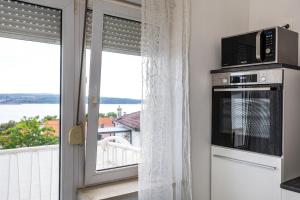 Kuchyň nebo kuchyňský kout v ubytování Studio Apartment Iva