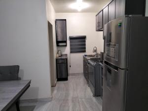 Η κουζίνα ή μικρή κουζίνα στο Departamento Esperanza 1 +9 φωτογραφίες