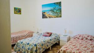Posteľ alebo postele v izbe v ubytovaní Sole Mare - Casa Vacanze Chiavarello