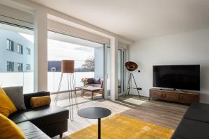 TV a/nebo společenská místnost v ubytování Ferienwohnung Industrial Style