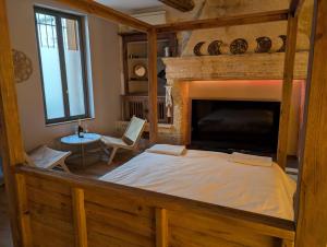 Postel nebo postele na pokoji v ubytování Suite avec jacuzzi privatif