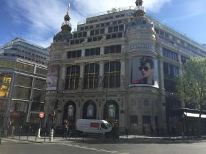 a large building with a billboard on the side of it at Idol Hotel in Paris